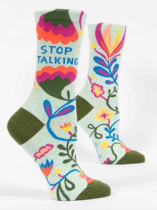 Blue Q Stop Talking W-Crew Socks: Light green ankle socks with colorful floral patterns, pink, yellow, blue accents, and bold "STOP TALKING" text—perfect for making a statement!.