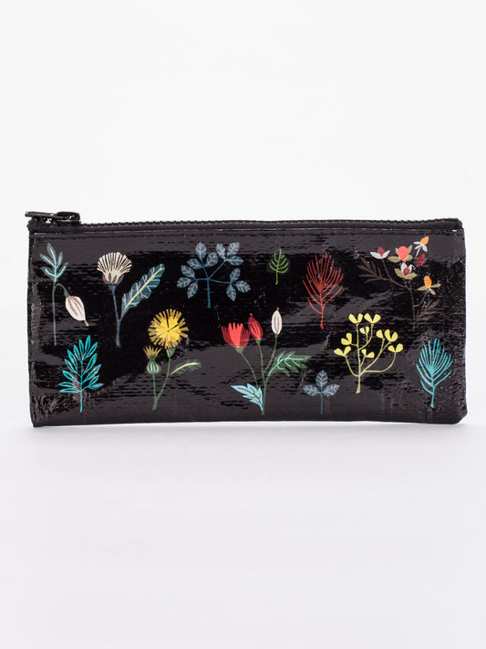 The Blue Q Plant Study Pencil Case is a black rectangular zippered pouch with colorful floral designs in green, yellow, red, blue, and white. Ideal for organizing phone chargers or storing pens and pencils. Plain white background.
