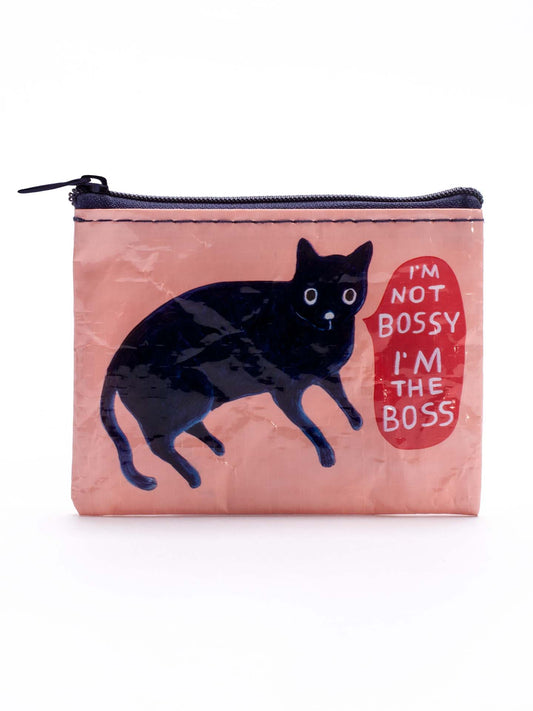 The Blue Q "I'm Not Bossy. I'm The Boss" Coin Purse is a small pink zippered pouch featuring a black cat and a red speech bubble—perfect for anyone who appreciates confidence with attitude.
