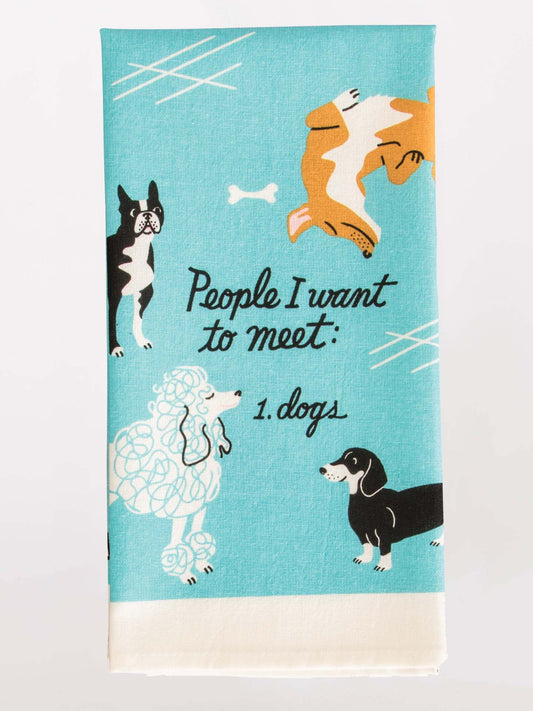 The Blue Q "People I Want To Meet: Dogs" Dish Towel features turquoise fabric, playful dog illustrations, a small white bone, and black lettering—an ideal gift for any dog lover’s kitchen!.