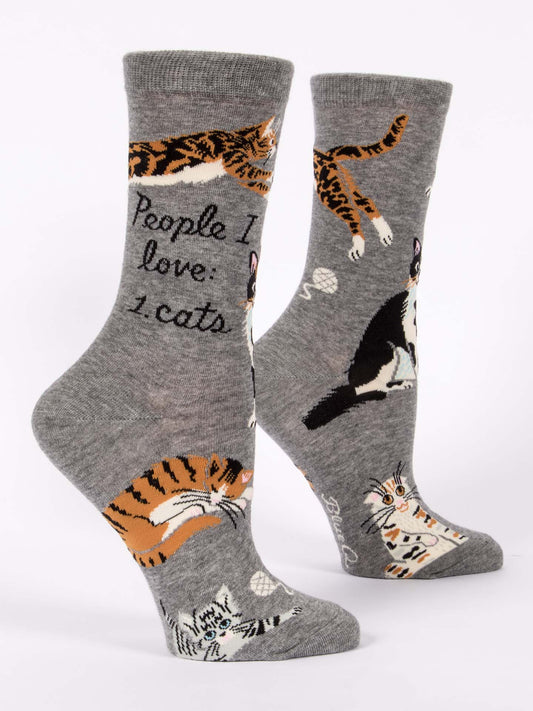 Blue Q’s People I Love: Cats W-Crew Socks feature playful cat illustrations and “People I love: 1. cats” text. Made with soft combed cotton and nylon spandex, these cozy gray crew socks display various cat breeds on a white background.