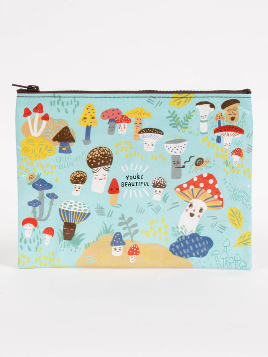 The Cute Lil Mushrooms Zipper Pouch by Blue Q features cheerful button mushrooms, plants, and "YOU’RE BEAUTIFUL" printed in the center—a charming, light blue accessory that’s cute as a button!.