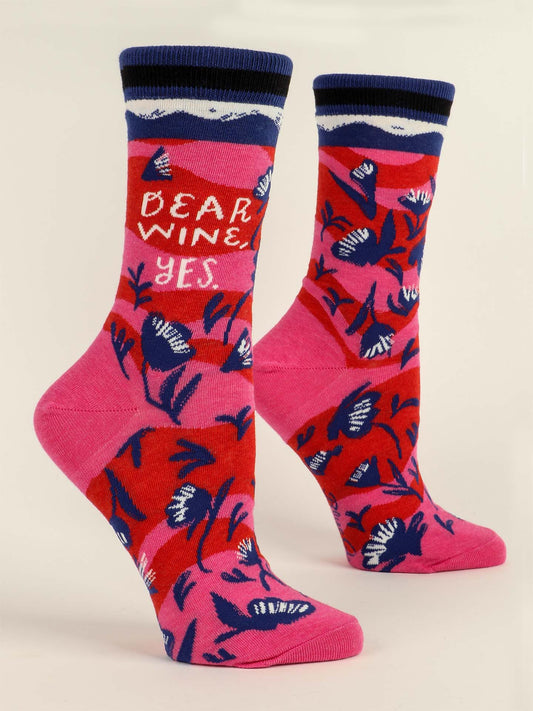 Blue Q Dear Wine, Yes. W-Crew Socks feature two colorful combed cotton socks with a red and pink background, dark blue and white floral designs, and “Dear Wine, Yes” text in white and red near the top.