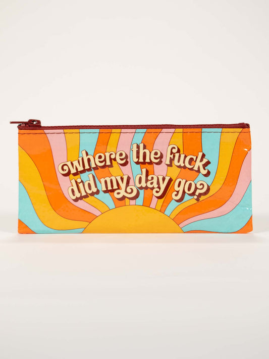 The Blue Q "Where'd My Day Go Pencil Case" is a colorful zippered pouch with retro sunburst patterns, featuring bold wavy text: "where the fuck did my day go?" and "oh shit, it happened again" on the front.