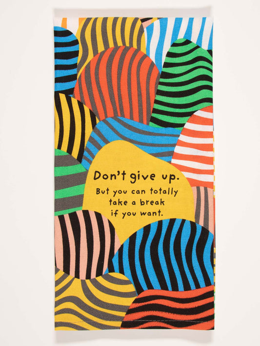 The Blue Q "Don't Give Up. But You Can Totally Take A Break If You Want." Dish Towel features vibrant wavy stripes and an encouraging message on a yellow background—perfect for daily inspiration.
