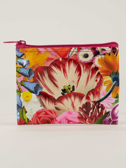 The Blue Q Blossom Coin Purse is a small zippered organizer with a bright floral design of tulips, roses, and daisies on a light background—ideal as a stylish storage pouch for your essentials.