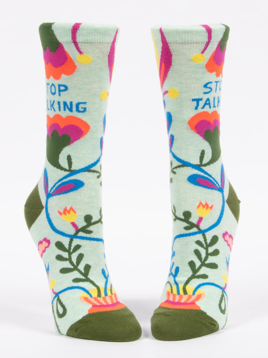 Blue Q's Stop Talking W-Crew Socks are light green ankle socks with colorful floral patterns, dark green toes and heels, and "STOP TALKING" printed near the top for a playful touch.