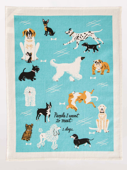 The Blue Q People I Want To Meet: Dogs Dish Towel features playful illustrations of dog breeds, bones, and the phrase "People I want to meet: 1. dogs."—a fun gift for any dog lover.
