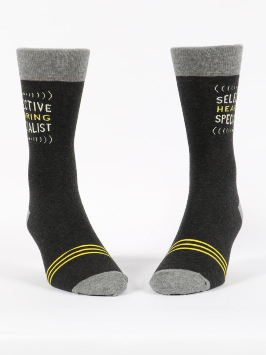Blue Q Selective Hearing M-Crew Socks: Black and gray combed cotton socks with yellow stripes by the toes, gray cuffs, and “SELECTIVE HEARING SPECIALIST” in yellow on the front.
