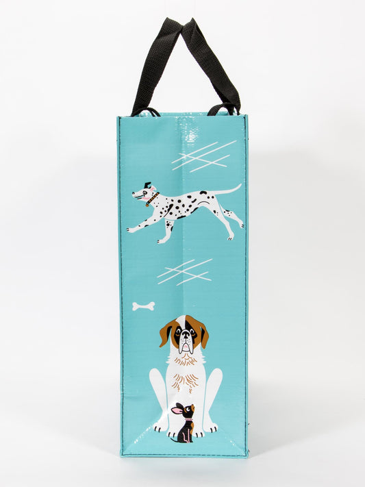 Blue Q’s People I Want To Meet: Dogs Shopper is a tall turquoise bag with black handles, dog illustrations (Dalmatian, St. Bernard, black-and-tan pup), playful bone and line designs—perfect for showing off your canine love in style.