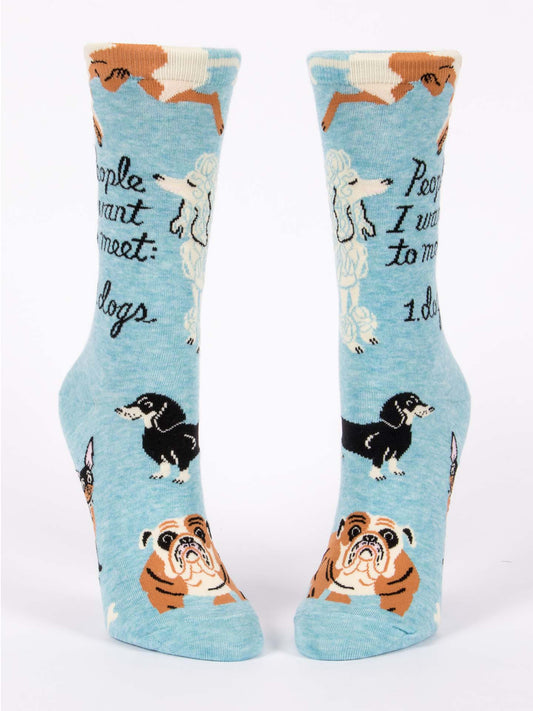 Blue Q's People I Want To Meet: Dogs W-Crew Socks are light blue socks with cute dog illustrations and the phrase “People I want to meet: 1. dogs”—an ideal fun gift for any dog lover!.