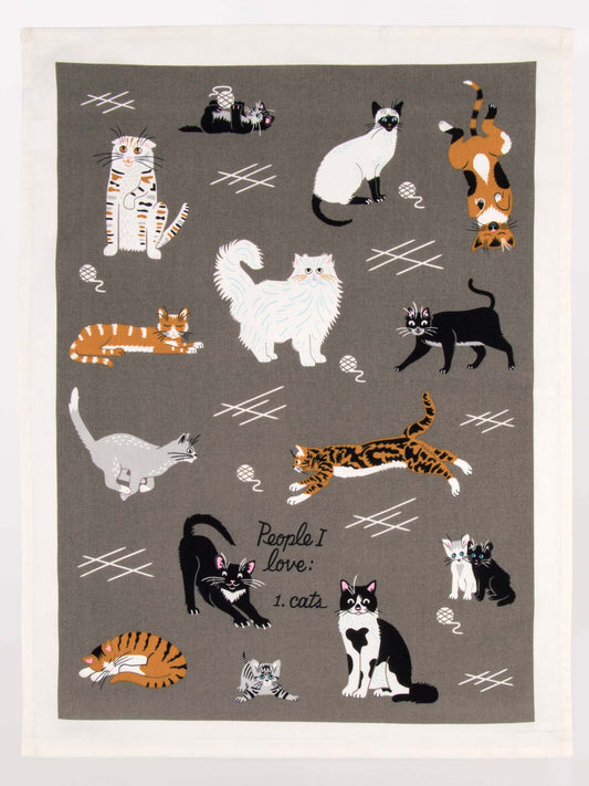 The Blue Q "People I Love: Cats Dish Towel" features playful cats on a gray background with handwritten text—an ideal tea towel for cat lovers and perfect company when dining solo.
