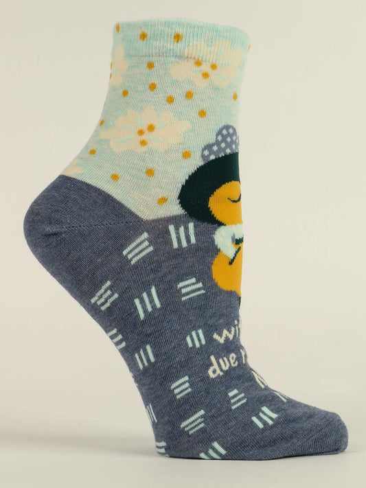 Blue Q's With All Due Respect, No. W-Ankle Socks feature soft combed cotton, a light blue cuff with white and yellow flowers, a cartoon bee in a hat holding a flower, and navy blue feet with white and light blue geometric accents.