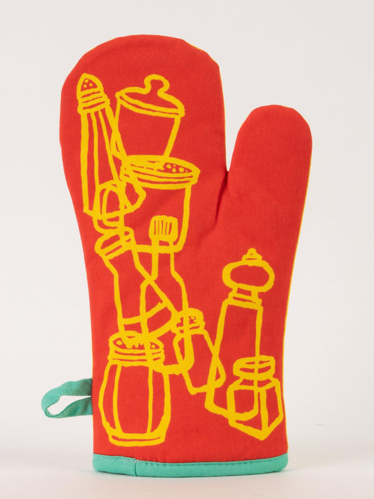 The Mr. Spice Guy Oven Mitt by Blue Q features red fabric with yellow line drawings of jars, a pepper mill, and a whisk, and is finished with a teal hanging loop and bottom trim—adding magic to your kitchen.