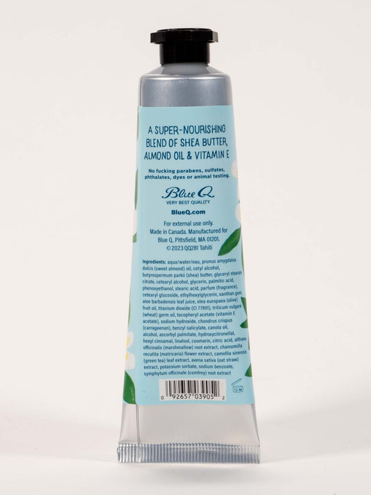 A light blue tube of Blue Q's "I'm A Delicate Fucking Flower" Hand Cream, Flowers Of Tahiti with melon & coconut, features a black cap and white flowers; enriched with shea butter, almond oil, and vitamin E. Ingredients on back.