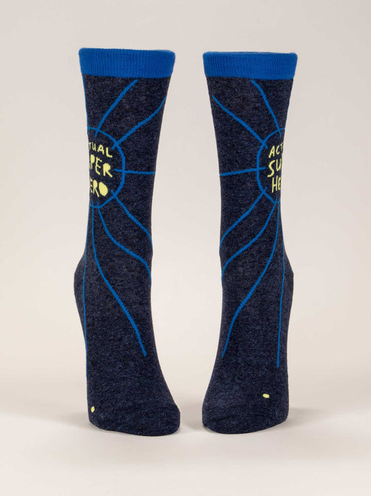 Step out in style with Blue Q's Actual Superhero W-Crew Socks—dark blue combed cotton socks featuring a yellow circle with "ACTUAL SUPER HERO" text, blue trim, and radiating lines to celebrate strength in every stride.