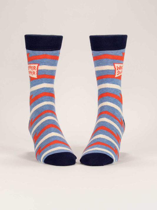 Blue Q Whippersnapper M-Crew Socks: blue combed cotton pair with red and light blue zigzag stripes, navy cuffs/heels/toes, and a red patch on each sock with white "WHIPPER SNAPPER" text.