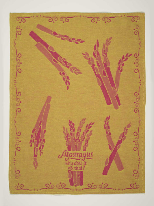The "Asparagus. Why Does It Do That?" Dish Towel by Blue Q features yellow fabric with red asparagus illustrations and the quirky phrase at the center, bordered by a decorative red pattern—a playful nod to asparagus's curious effects.