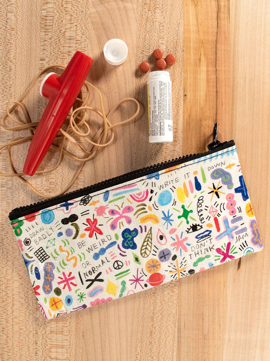 The Blue Q Doodle Party Pencil Case, featuring playful doodles and sayings, sits on a wooden surface with a red kazoo, rubber band, white glue stick, and four brown beads.
