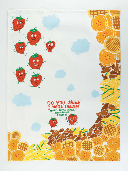 The Blue Q "Do You Think I Made Enough? Maybe I Should Double It. I Should Probably Double It." dish towel features cheerful strawberries atop a heap of treats—fun and quirky, it's perfect for anyone who loves seconds.