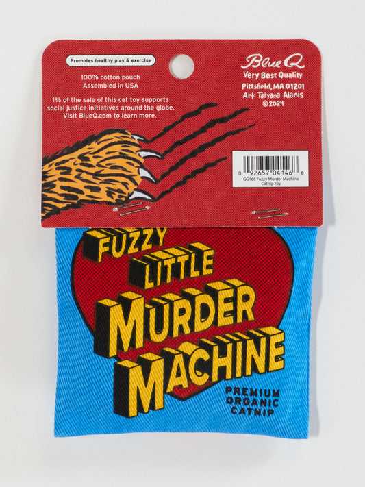 A blue pouch labeled “Fuzzy Little Murder Machine” in bold yellow and red with a black 3D shadow, this Blue Q Catnip Toy comes with a red tag showing cartoon tiger claws and product info for healthy play.