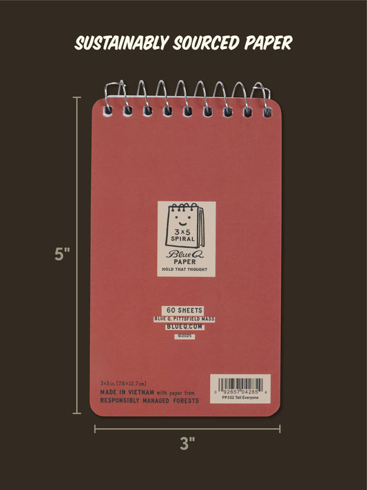 The Blue Q "Just Between You And Me I'm Gonna Tell Everyone" 3x5 spiral notebook has a red cover, 60 blue-lined sheets on sustainably sourced paper, a cartoon paper logo, and is made in Vietnam from responsibly managed forests.