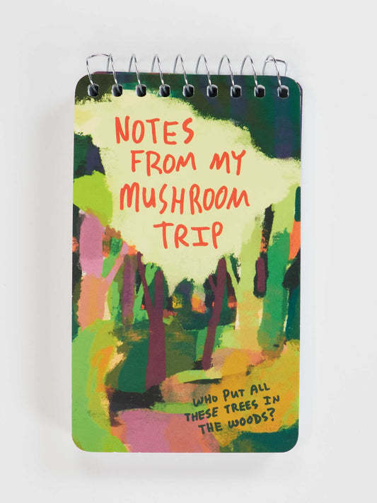 The Blue Q "Notes From My Mushroom Trip" 3x5 Spiral Notebook features a colorful abstract tree design and quirky cover text—ideal for jotting down your thoughts on the go.