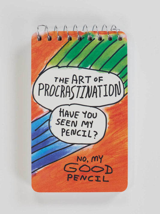 The Art Of Procrastination 3x5 Spiral Notebook by Blue Q features playful text—“Have You Seen My Pencil? No, My Good Pencil”—on a vibrant red, green, and blue cover. Study in style with this fun, compact notebook!.