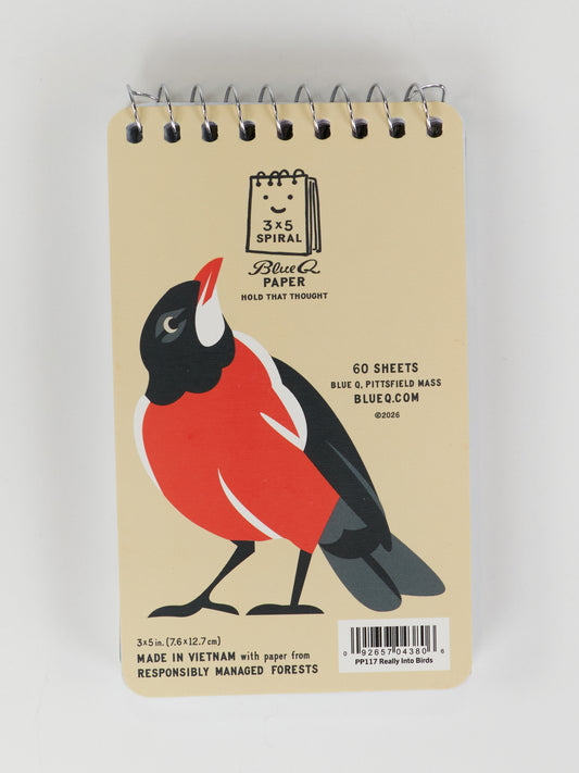 The Blue Q “I'm Really Into Birds” 3x5 spiral notebook features a beige cover with a red-breasted bird illustration, contains 60 sheets of responsibly sourced paper, and is made in Vietnam—ideal for sketches and notes.