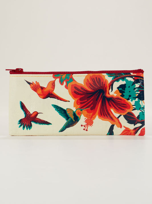 The Blue Q Hummingbird Pencil Case features a cream background with red and orange hibiscus flowers, three colorful hummingbirds, and a red zipper—an ideal choice for fans of stylish bags.