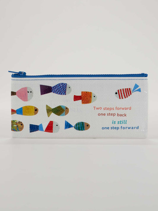 The Blue Q "Two Steps Forward One Step Back Is Still One Step Forward" Pencil Case features colorful fish prints and an inspiring quote—a perfect motivational gift for daily encouragement.