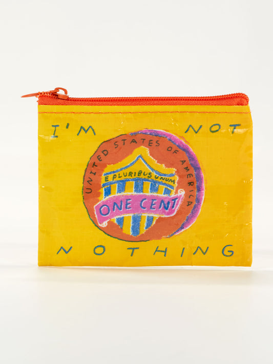 The Blue Q "I'm Not Nothing Coin Purse" is a small yellow pouch with a U.S. penny graphic and the phrase IM NOT NOTHING, bringing bold statement tee attitude to a fun, zippered accessory.