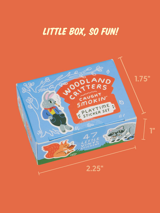 Small rectangular box measuring 2.25 by 1.75 by 1 inches, the Woodland Critters Caught Smokin’ Playtime Sticker Set by Blue Q contains vinyl stickers of cute critters and other woodland animals.