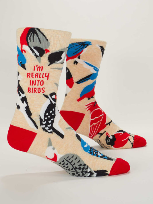 Blue Q's "I'm Really Into Birds" M-Crew Socks feature beige combed cotton, colorful birds, and red accents, with “IM REALLY INTO BIRDS” printed in red—perfect for any bird enthusiast.