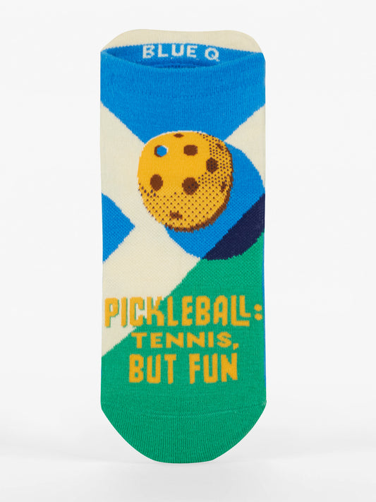Blue Q’s Pickleball: Tennis, But Fun Sneaker Socks feature a yellow pickleball over a blue and white court, shock-absorbing cushion, fun slogan in yellow, and the Blue Q logo printed inside the cuff.