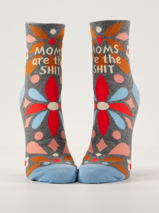 Blue Q Moms Are The Shit W-Ankle Socks are gray combed cotton socks featuring colorful flower patterns and "Moms are the shit" printed in white letters.