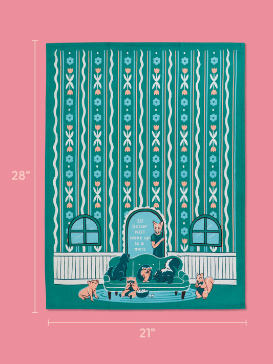The Blue Q "I'd Better Not Wake Up To A Mess" Dish Towel, 28x21", is super-absorbent, features teal and pink colors, a woman with many cats on a couch, floral stripes, windows, and the phrase "It's better NOT to wake up as a mess!.