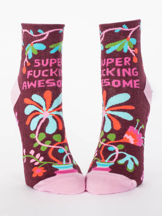 Blue Q Super Fucking Awesome W-Ankle Socks: maroon socks with colorful floral patterns and "SUPER FUCKING AWESOME" in bold pink, soft nylon-cotton blend, light pink toes and heels for comfort.