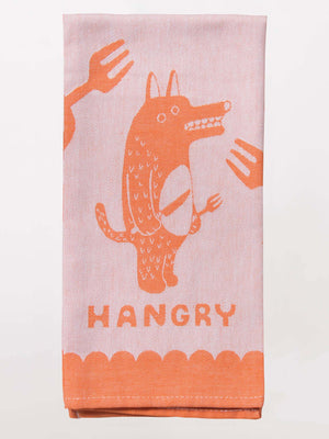 The Blue Q Hangry Dish Towel features a pink and orange cartoon animal with wolf utensils, surrounded by forks, and "HANGRY" boldly printed below.