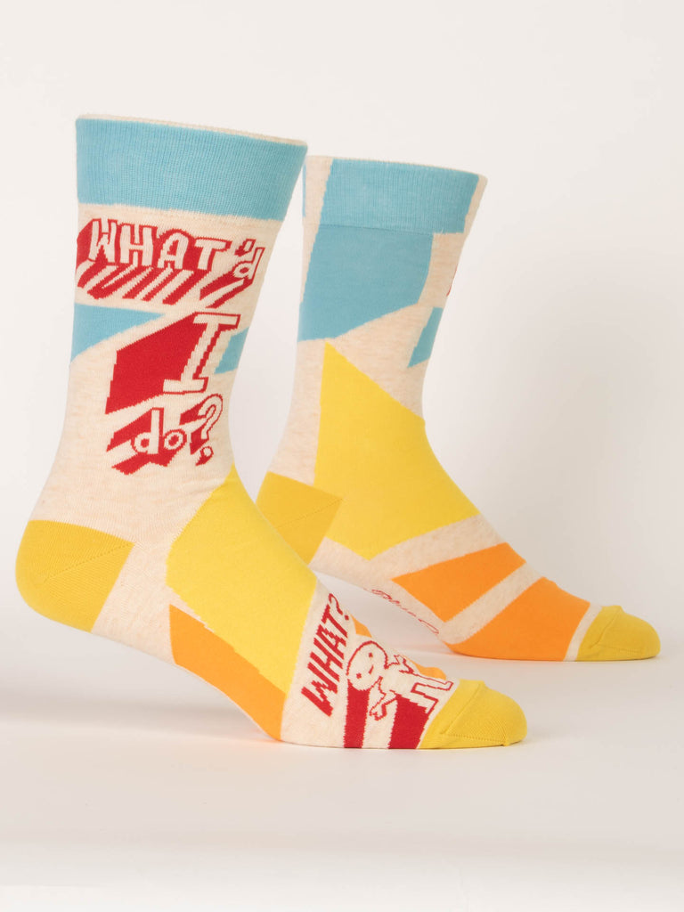 The Blue Q Fun For All Sale Pack includes colorful men's crew socks with geometric patterns in yellow, orange, blue, and cream, red "WHATD I do?" text, and a cartoon figure near the toes—a quirky gift bundle favorite.