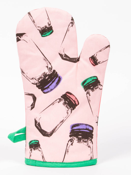 The Blue Q "Bitch I Am The Secret Ingredient" oven mitt features a pink design with illustrated jars labeled saffron and paprika, each topped with green, purple, and red lids on a white background.