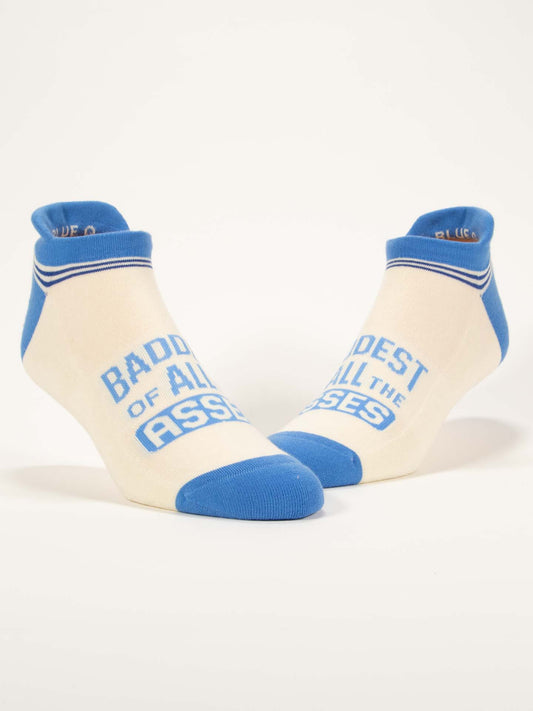 Blue Q’s Baddest Of All The Asses Sneaker Socks are white ankle socks with blue toes, heels, and cuffs, plus bold blue text across the tops for comfort and attitude.