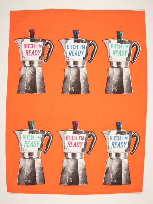 The Blue Q Bitch I Am Ready Dish Towel is an orange cloth with six moka pots labeled "BITCH IM READY." The alternating pink/green and blue/green lids and text give it an energetic, vibrant look—perfect to start your engines.