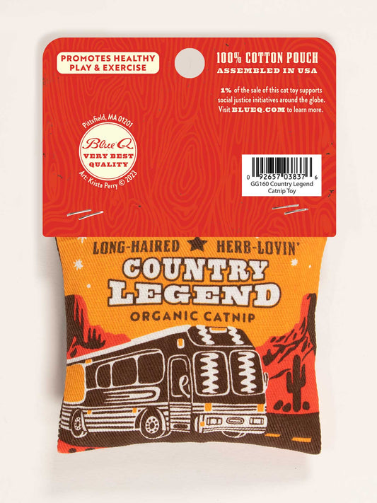 The Blue Q Long-Haired Herb-Lovin' Country Legend Catnip Toy pouch features a tour bus and trees, with a red tag promoting healthy play and exercise. It’s made from 100% cotton with organic catnip, all assembled in the USA.