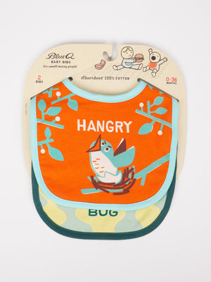 Blue Q’s Hangry/Certified Cuddle Bug Baby Bibs set includes an orange “HANGRY” bird bib and a light green “BUG” leaf bib in fun cartoon packaging—soft, cotton, and perfect for mealtime messes.