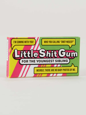 A box of Blue Q Little Shit Gum—bright candy-coated gum with speech bubbles like “I’m coming with you!” and “Who you calling snot-nosed?” Perfect for the tagalong youngest sibling.