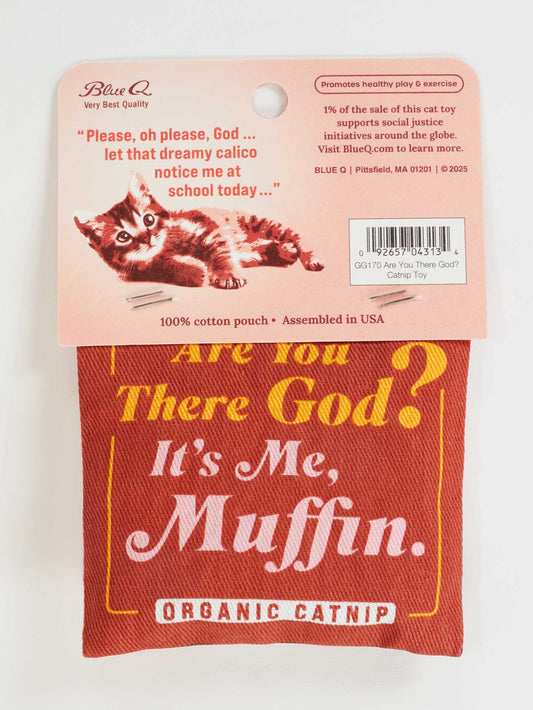 The Blue Q "Are You There God? It's Me. Muffin." Catnip Toy is a red cotton pouch with retro kitten art and playful text, filled with organic catnip. Packaging humorously depicts a cat hoping to be noticed by a calico at school.