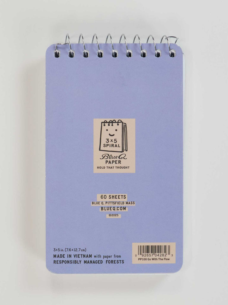 The "I Love To Go With The Flow. My Flow, Not Yours 3x5 Spiral Notebook" by Blue Q is a small blue spiral-bound notepad with 60 sheets from responsibly managed forests and a barcode at the bottom.