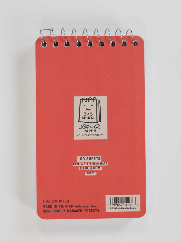 The Took A Taste Of My Own Medicine And Would You Look At That I'm Cured 3x5 Spiral Notebook by Blue Q is shown from the back, displaying branding, barcode, a playful “feel better” message, and notes that it’s made in Vietnam with responsibly managed forest paper.