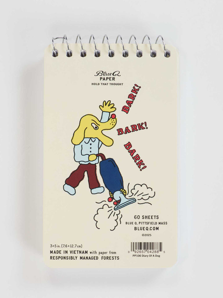 The Blue Q "Diary Of A dog. Licked Some Faces, Sniffed A Bush, Barked At A Vacuum" 3x5 spiral notebook features a cartoon dog barking at a vacuum—perfect for diary entries and made from responsibly managed forests.